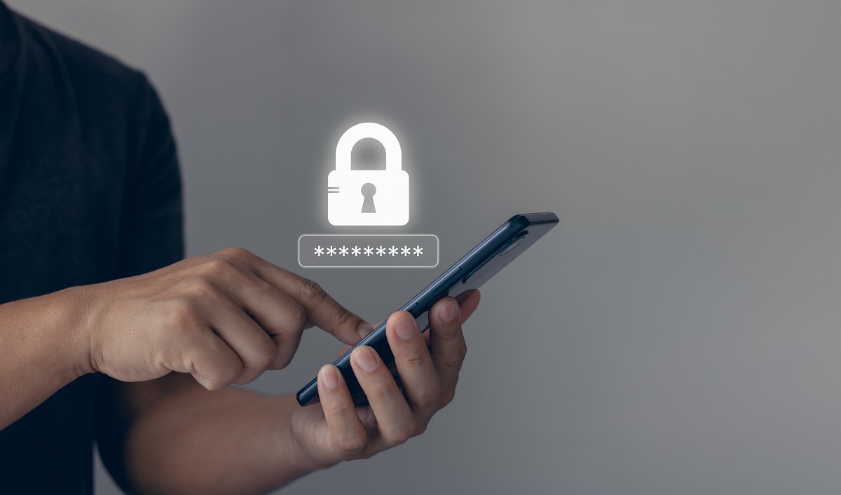 person logging into phone with lock icon