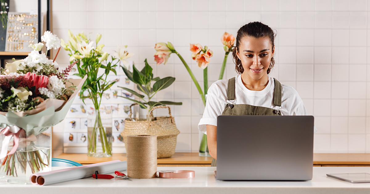 business owner on laptop at desk