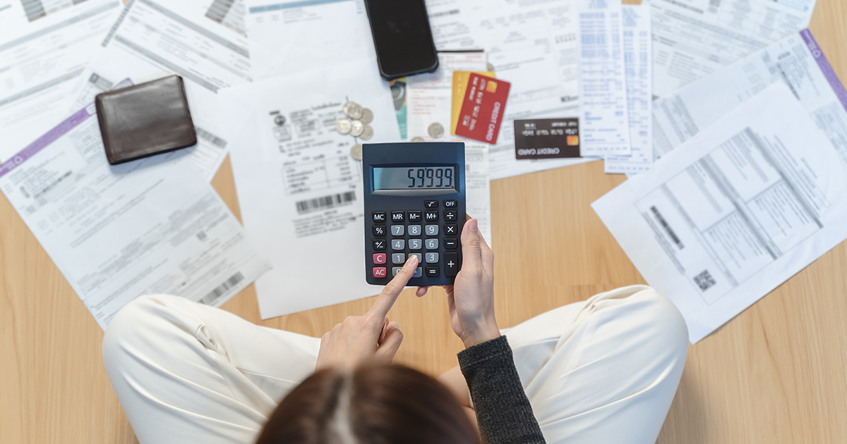 credit cards and bills laid out on floor