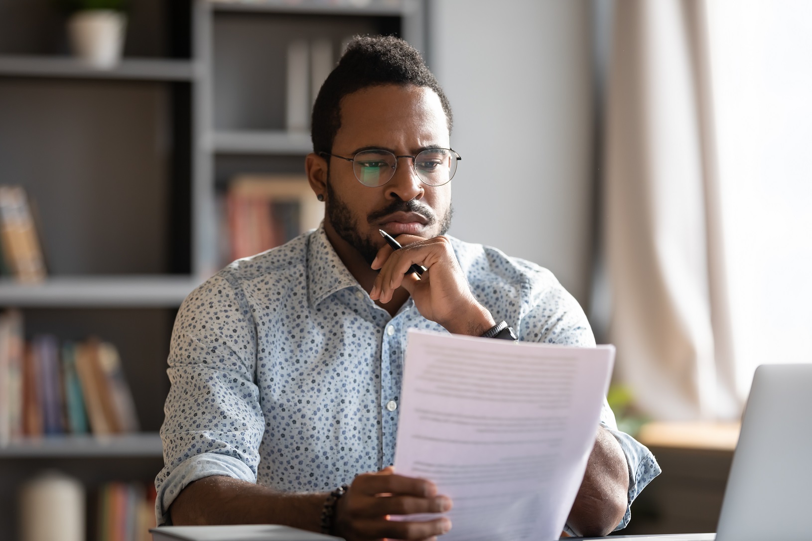 man looking at loan terms