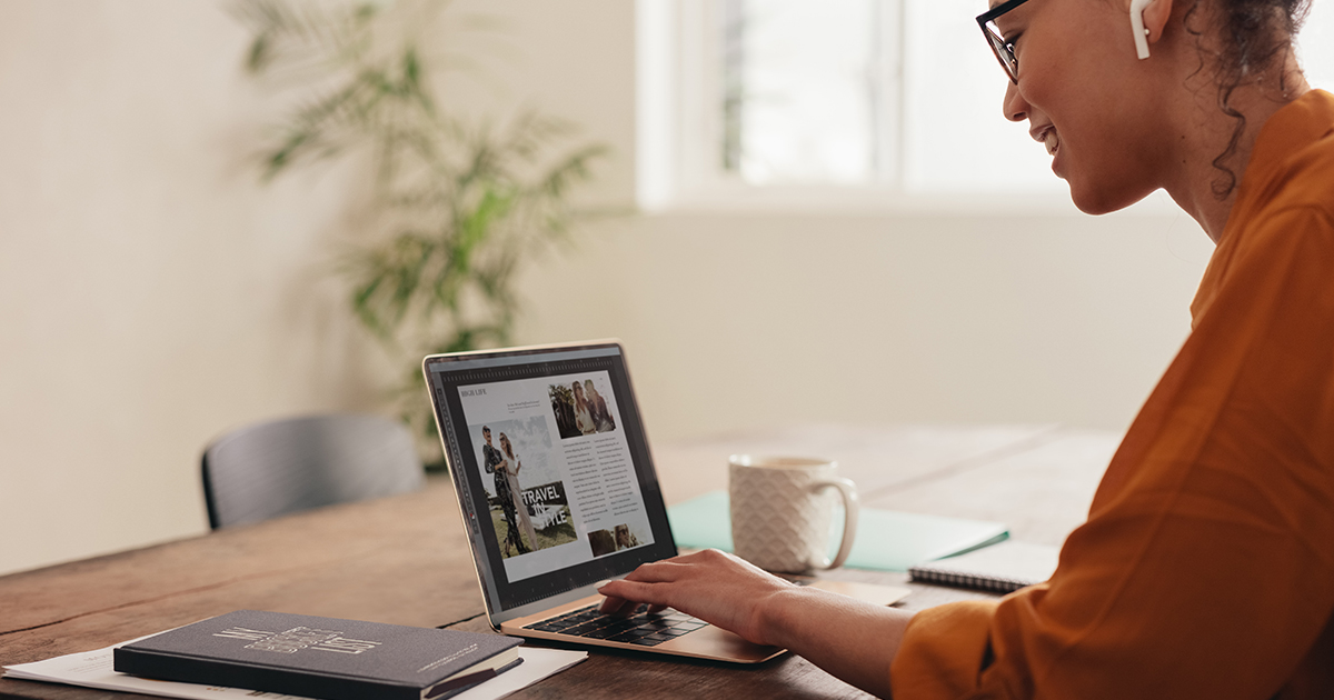 person designing website on laptop