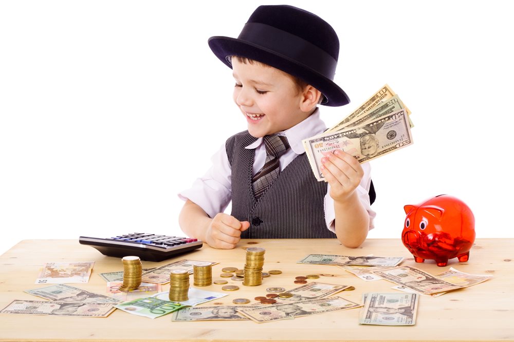 child plays with money