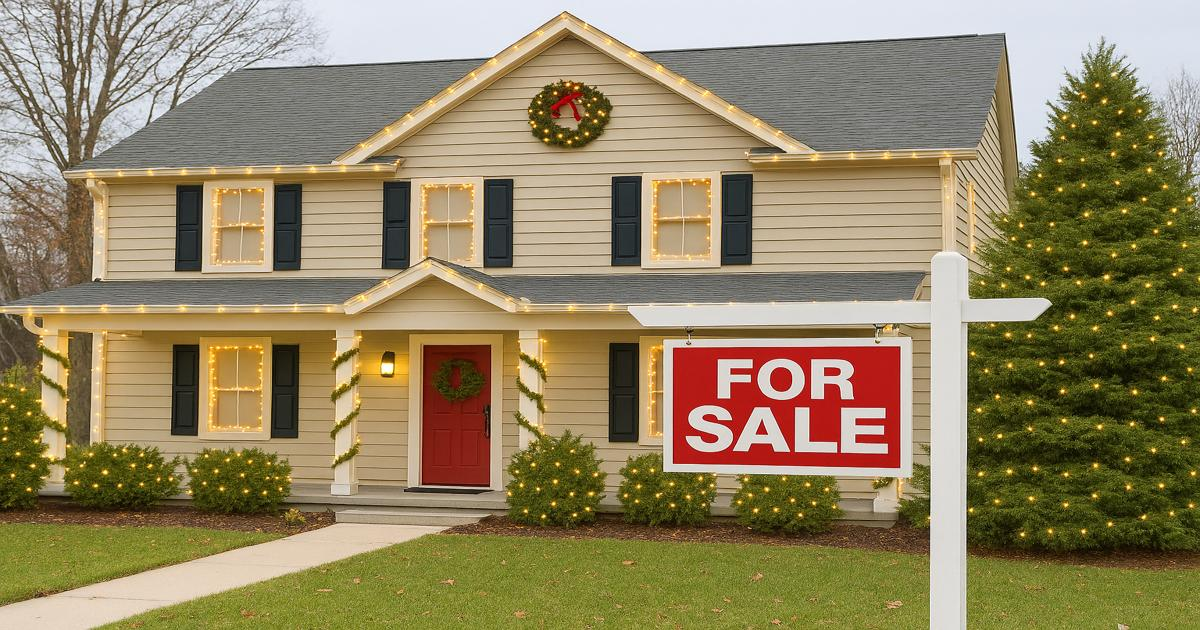 home with Christmas lights and "for sale" sign