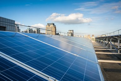 solar panels with skyline in background