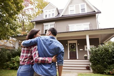 Couple Standing in front of a house