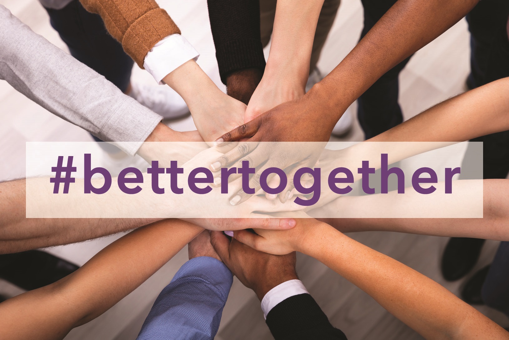people's hands in a circle with text "#bettertogether"