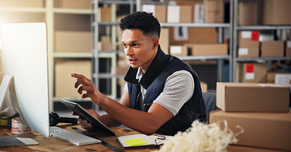 person at computer doing inventory