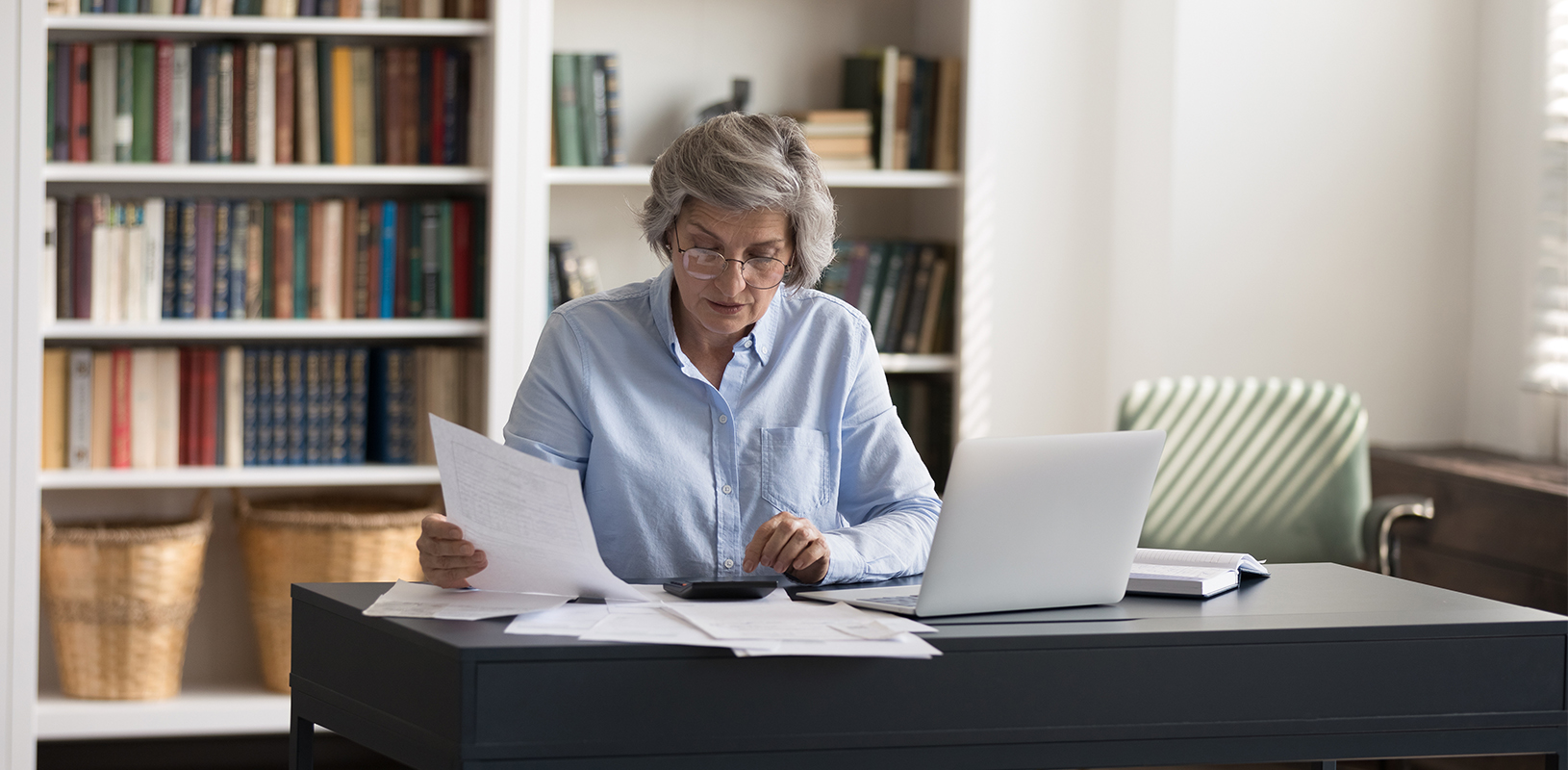 person reviewing finances at desk