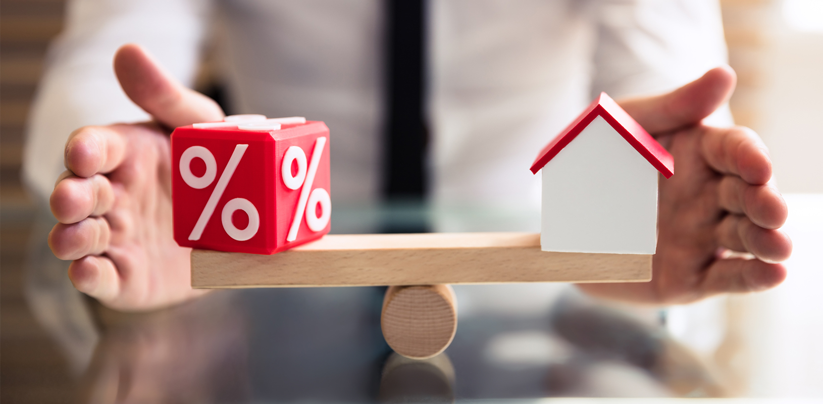 scale with percentage dice and house figurine