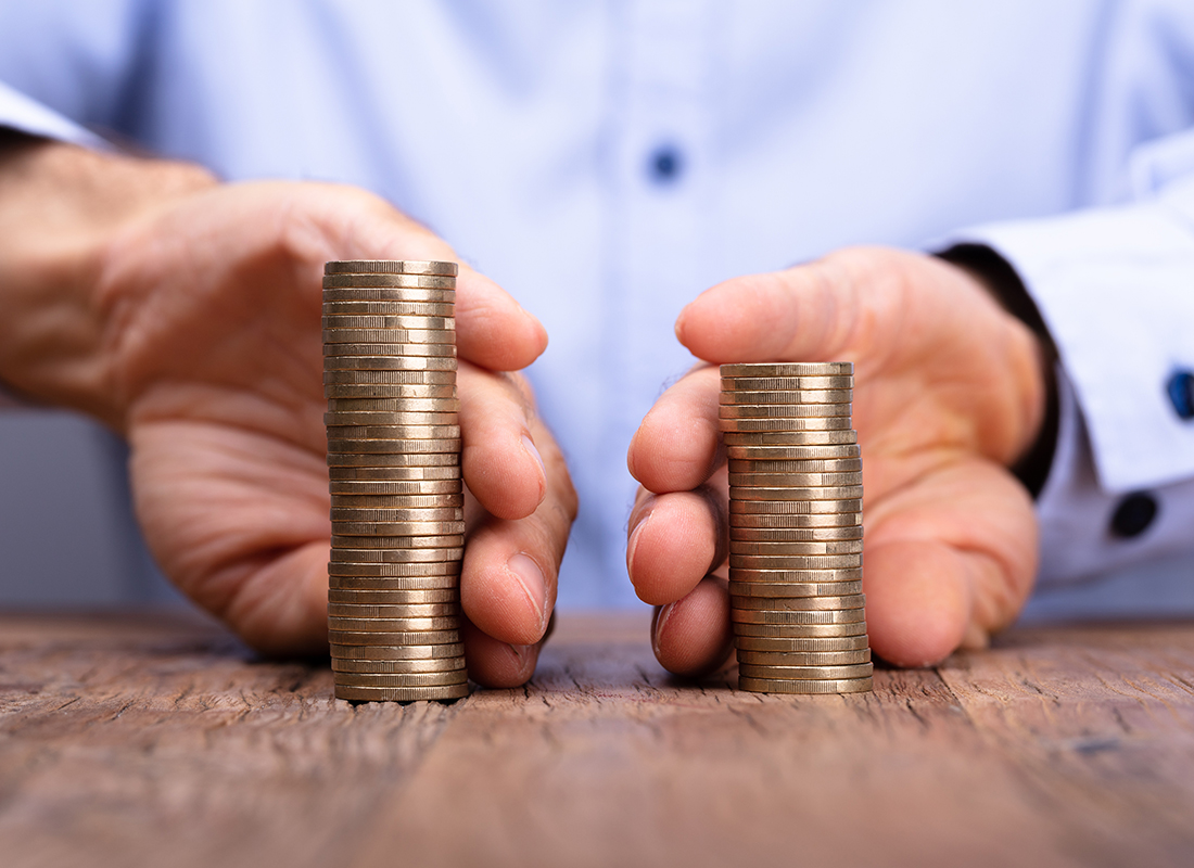 person separating coins on a table