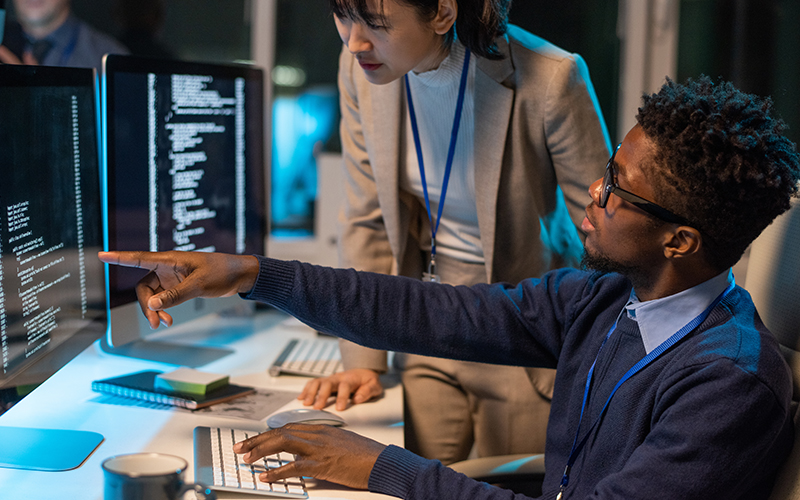 business people looking at computer security settings