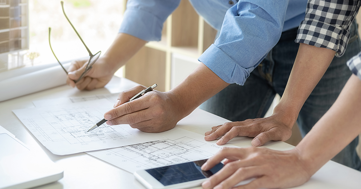 looking at blueprint of additional building