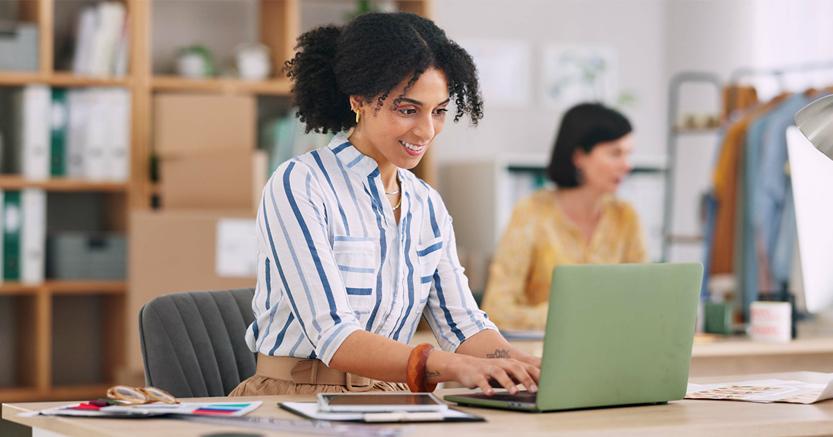 woman on laptop at business