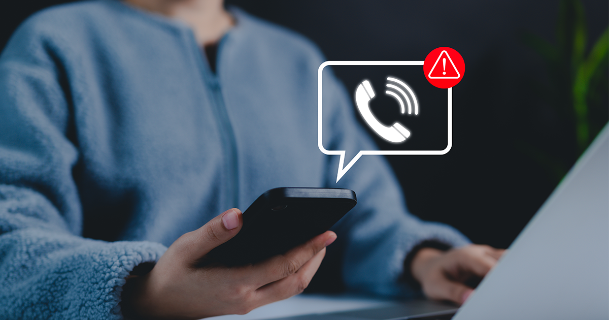 person holding cell phone with call icon showing