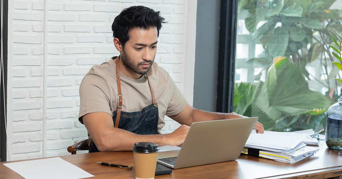 person on laptop in business