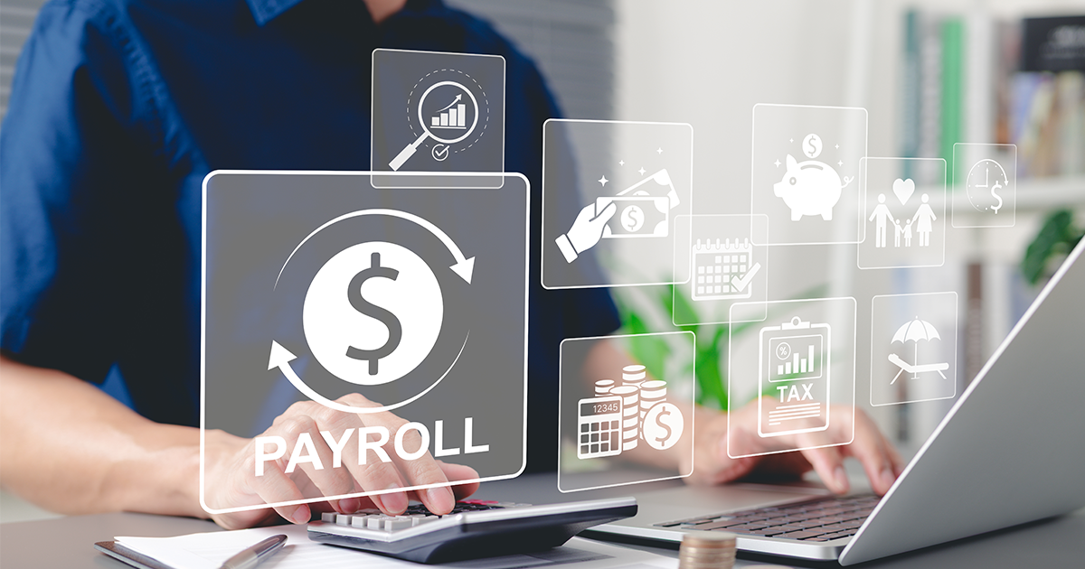 payroll icons in front of person on laptop