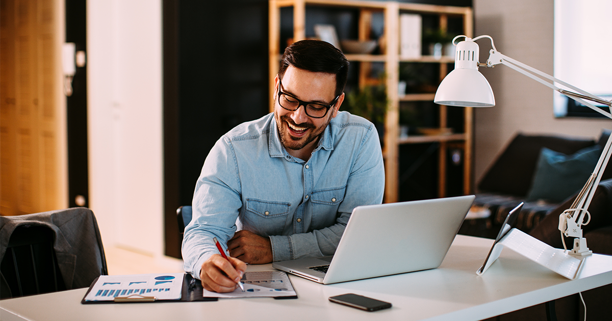 person at in-home office desk