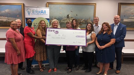 group photo with EforAll, BankFive check presentation