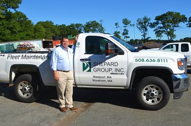 Don Giumetti, Owner of Shepard Group, Inc standing next to one of his company's trucks