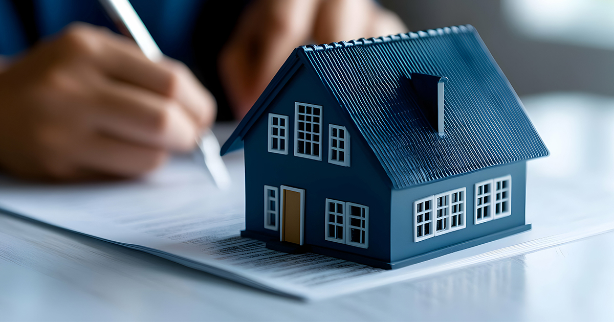 house figurine on a piece of paper